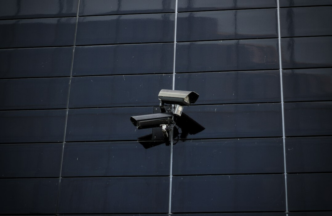 store security guard monitoring cameras