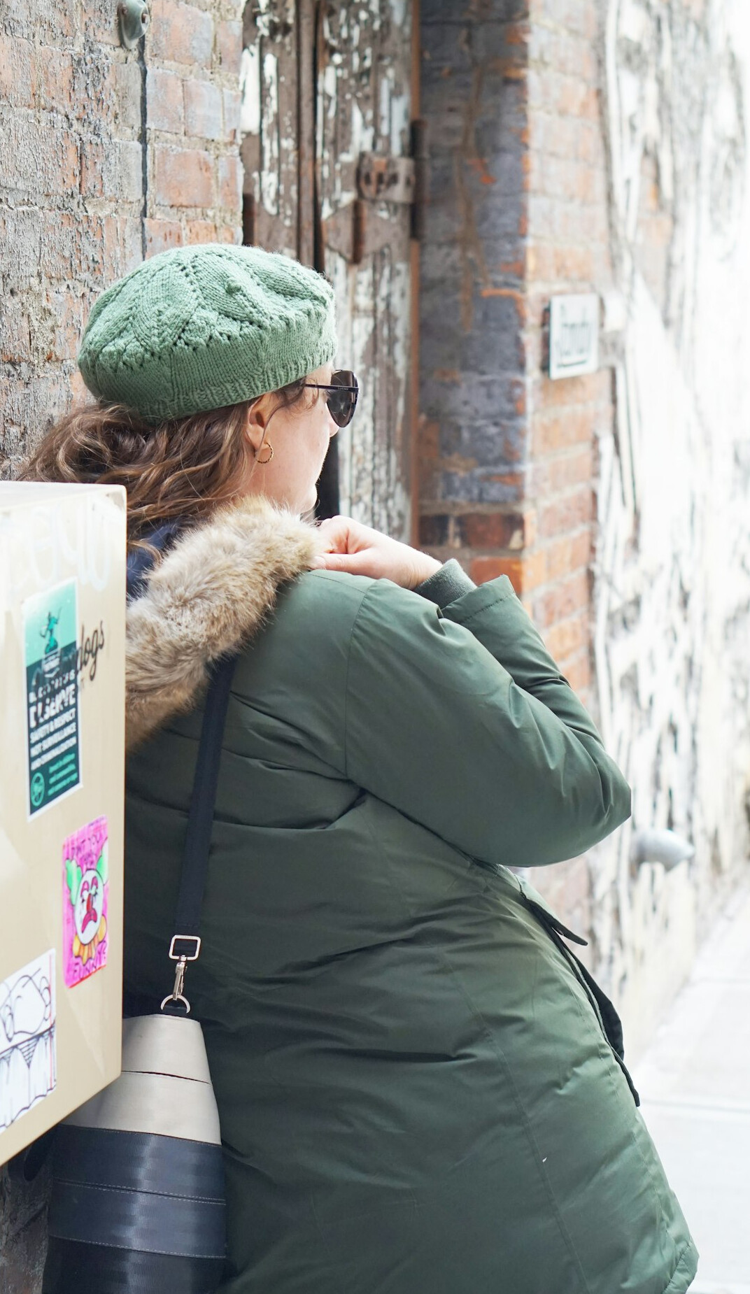 woman hiding items in bag